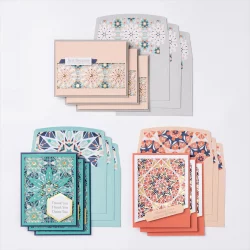 Image shows three different greeting cards and their envelopes, all with a kaleidoscope theme. The main colors are peach, light blue, navy and gray. These are the cards featured in the Stampin'Up Colorful Kaleidoscope Card Making kit.